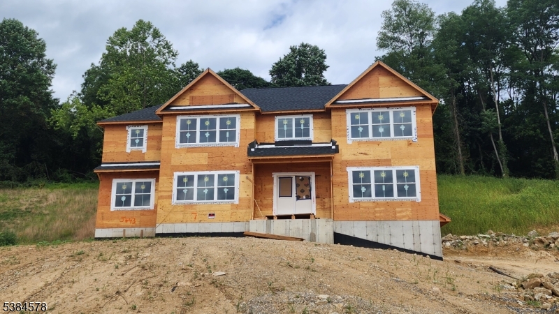 7 Spring Court Phillipsburg, NJ 08865 - Photo 2 of 2 a front view of a house with a yard