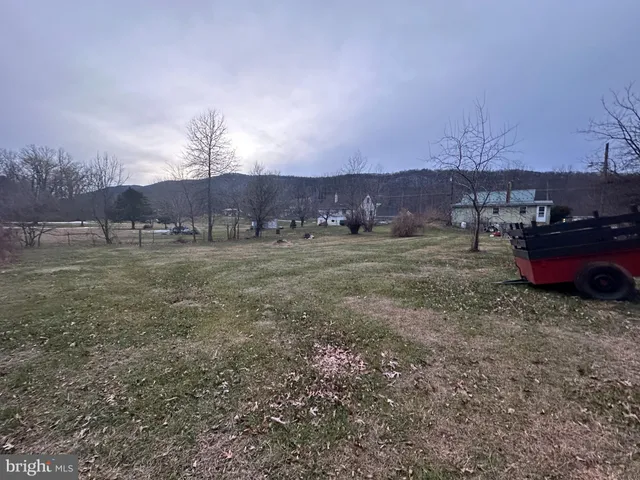 a view of an chairs and table in the patio