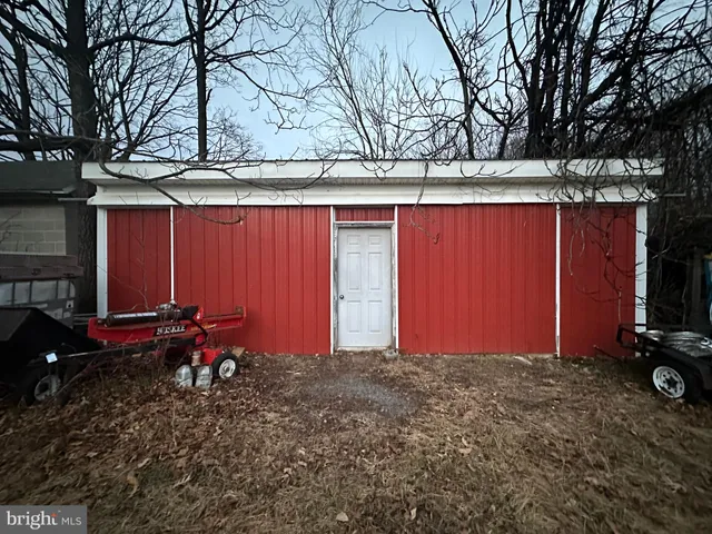 a kitchen with a cabinets and wooden floor
