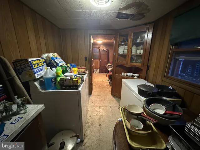 a view of storage and utility room with a window