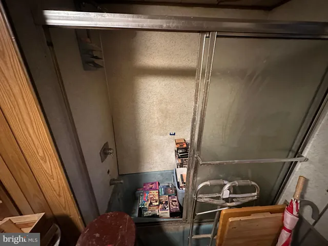 a bathroom with a toilet and shower