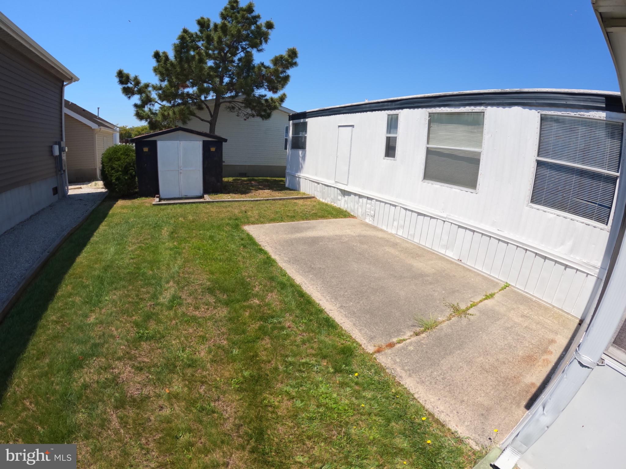 163 Clamshell Road Ocean City, MD 21842 - Photo 14 of 18 a front view of a house with garden
