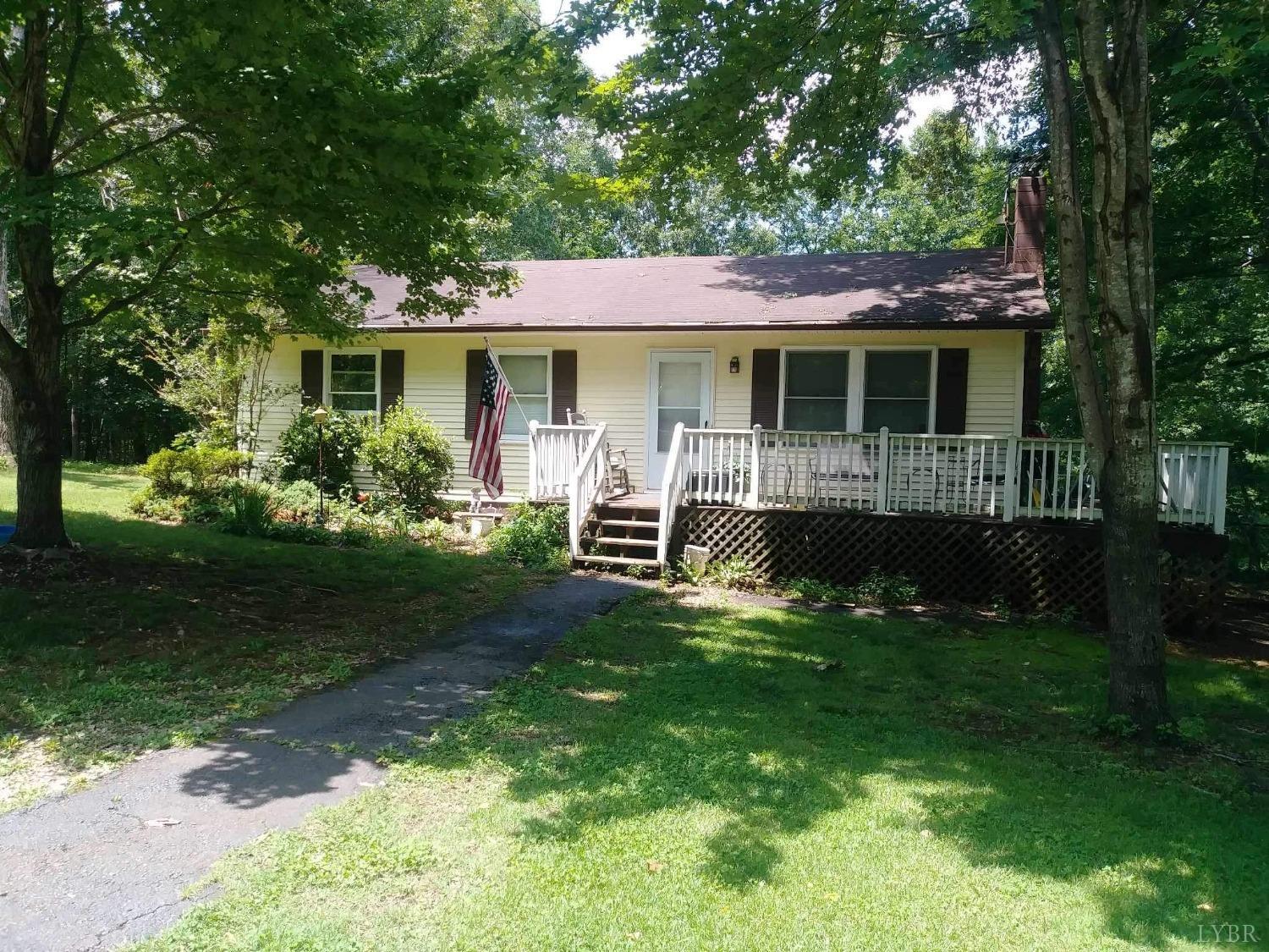283 Village Road Shipman, VA 22971 - Photo 1 of 12 a front view of a house with garden