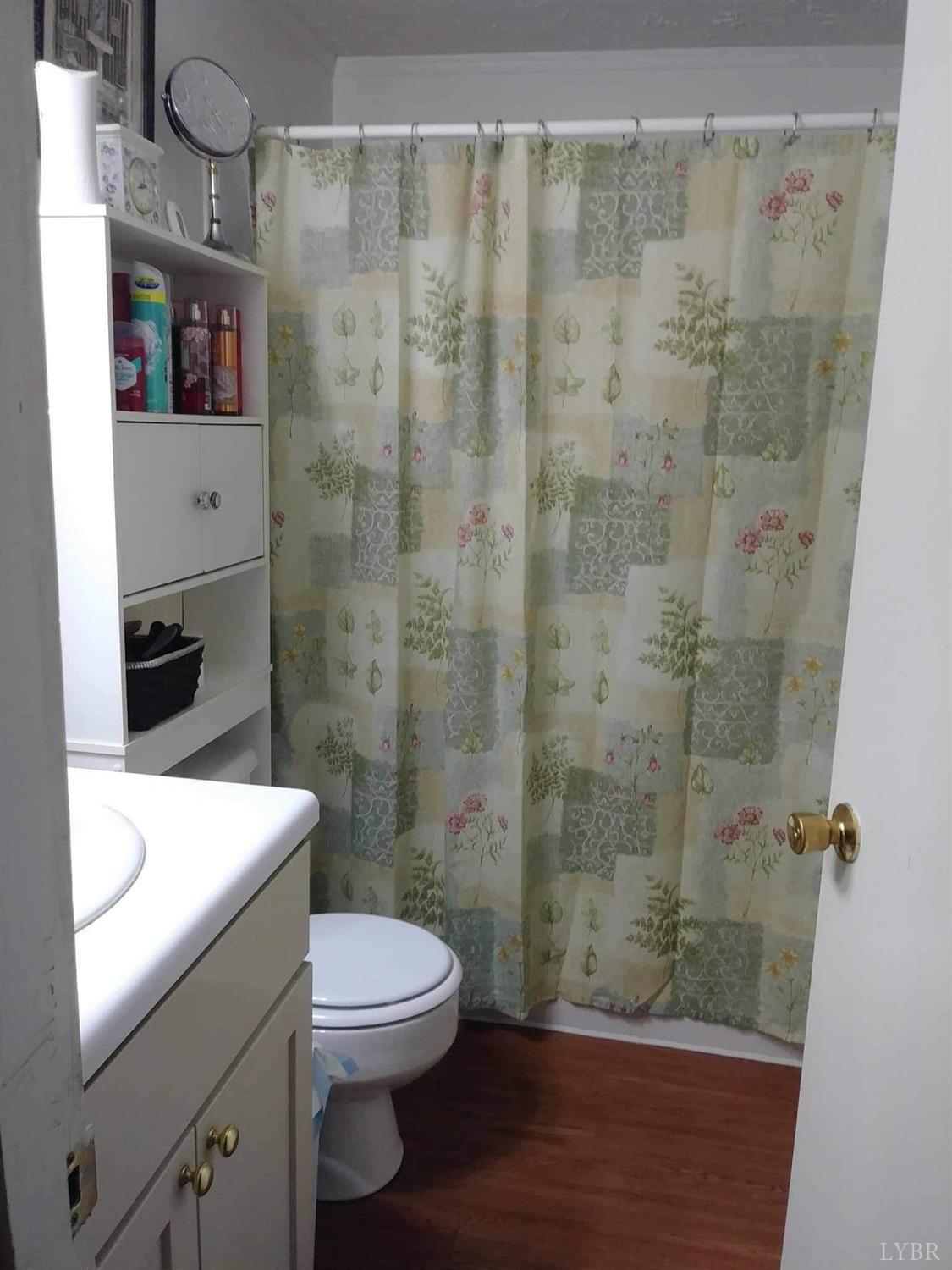 283 Village Road Shipman, VA 22971 - Photo 7 of 12 a bathroom with a toilet a sink and shower