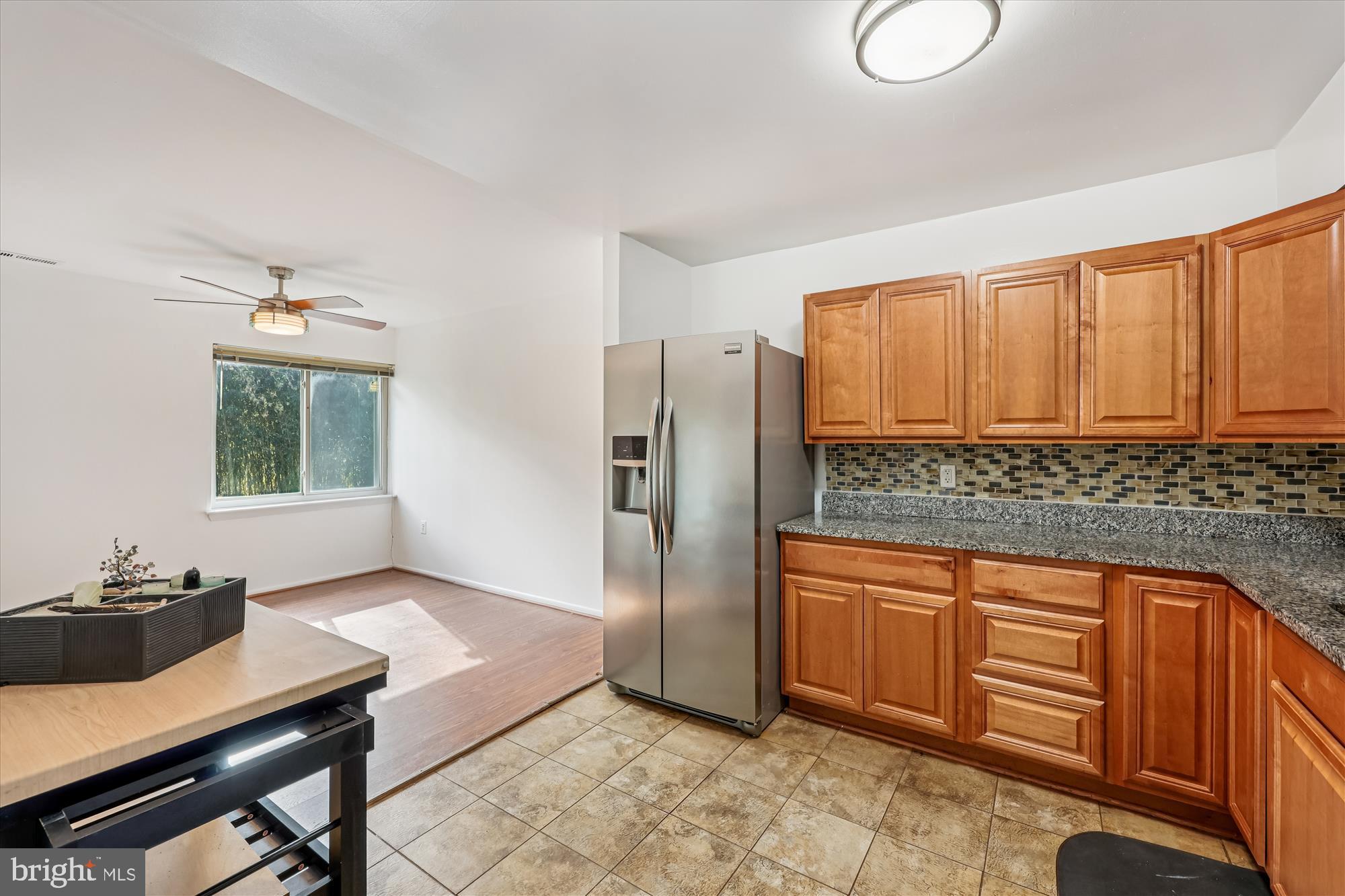 14428 Parkvale Road, Unit 3 Rockville, MD 20853 - Photo 14 of 37 a kitchen with stainless steel appliances granite countertop a refrigerator and a sink