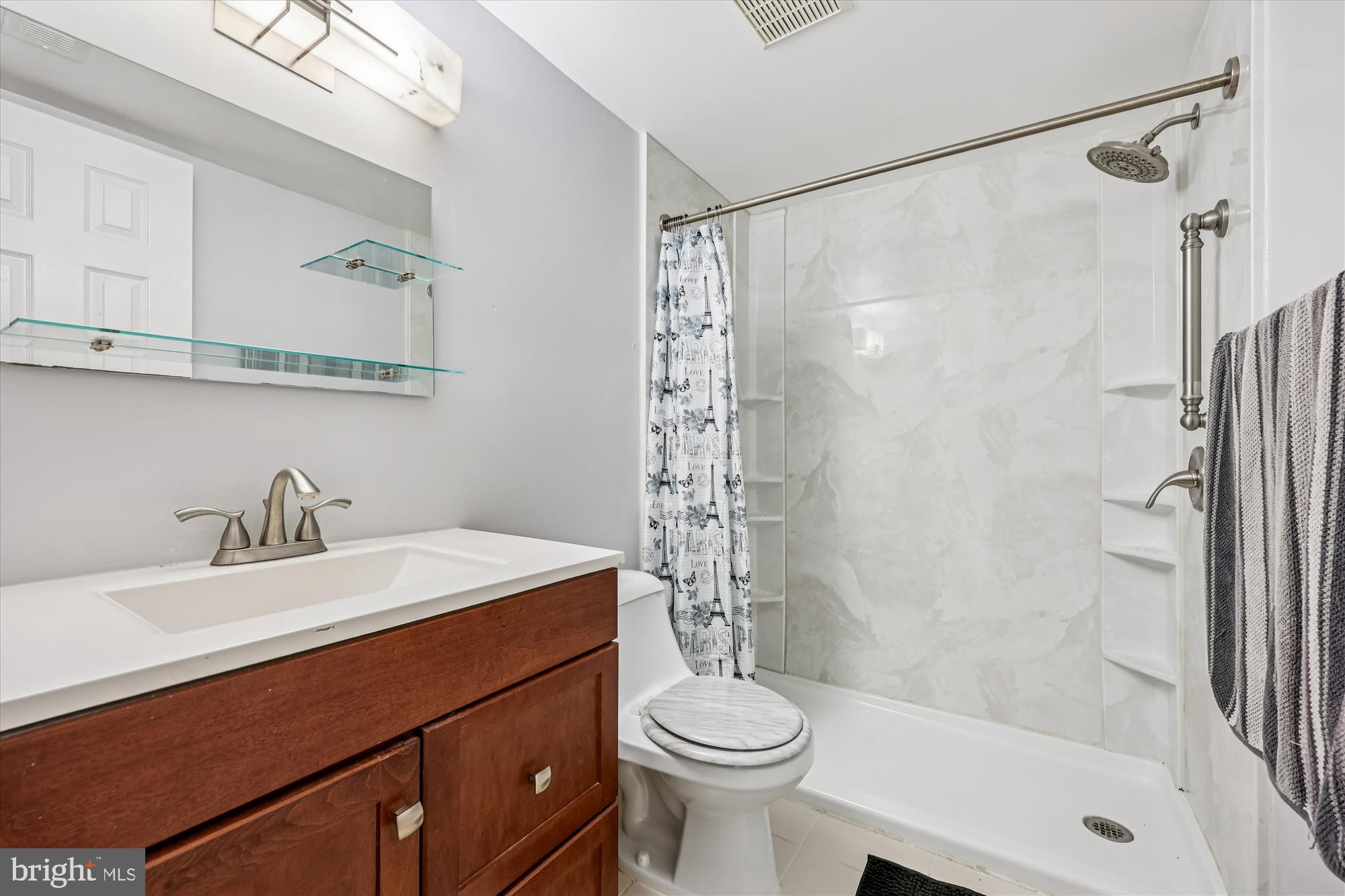 14428 Parkvale Road, Unit 3 Rockville, MD 20853 - Photo 20 of 37 a bathroom with a sink a toilet and shower