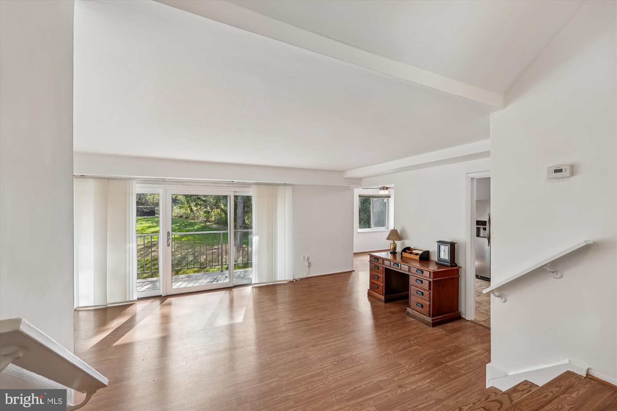 14428 Parkvale Road, Unit 3 Rockville, MD 20853 - Photo 3 of 37 wooden floor in an empty room with a window