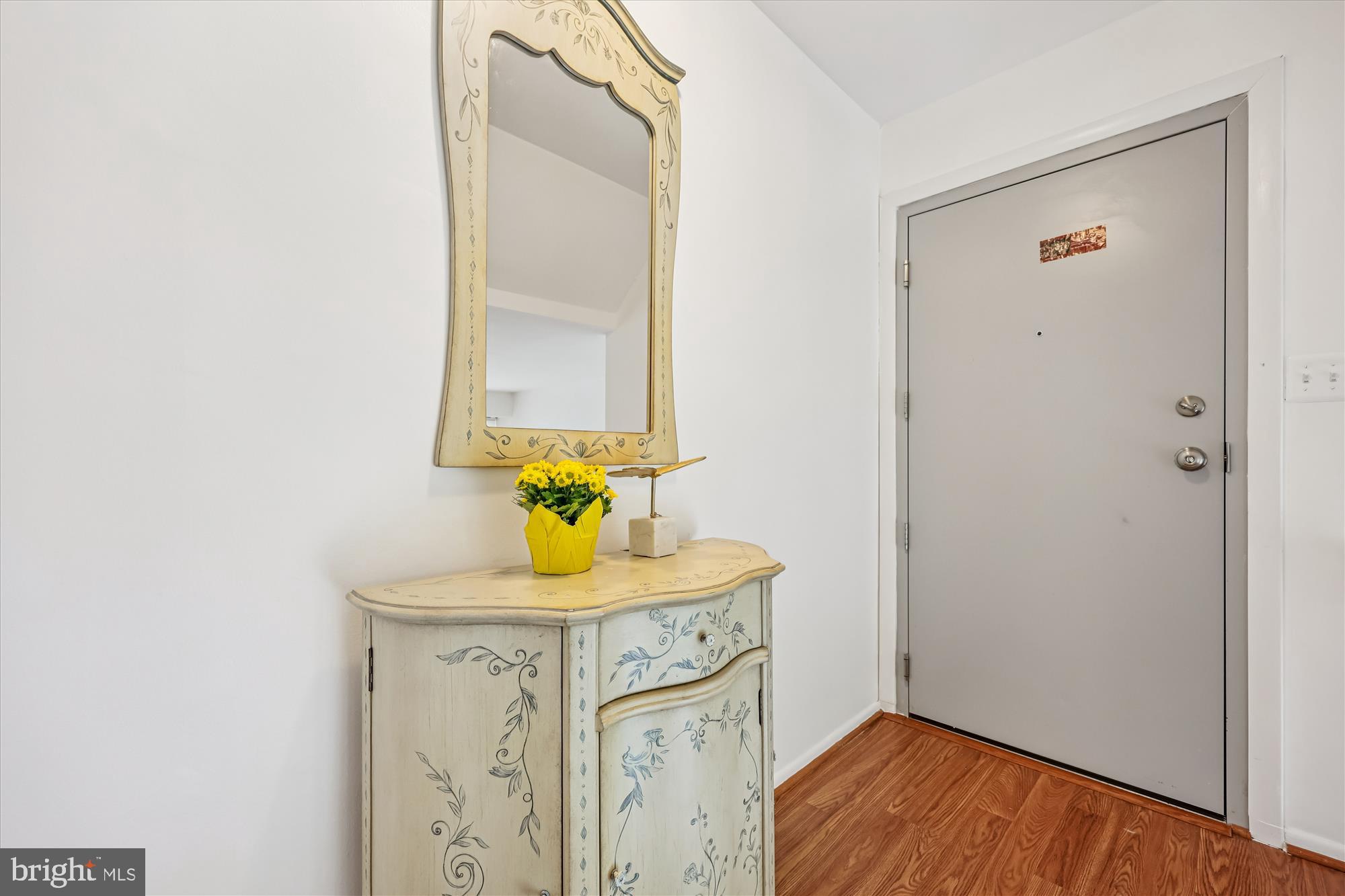 14428 Parkvale Road, Unit 3 Rockville, MD 20853 - Photo 5 of 37 a bathroom with a sink vanity and a mirror