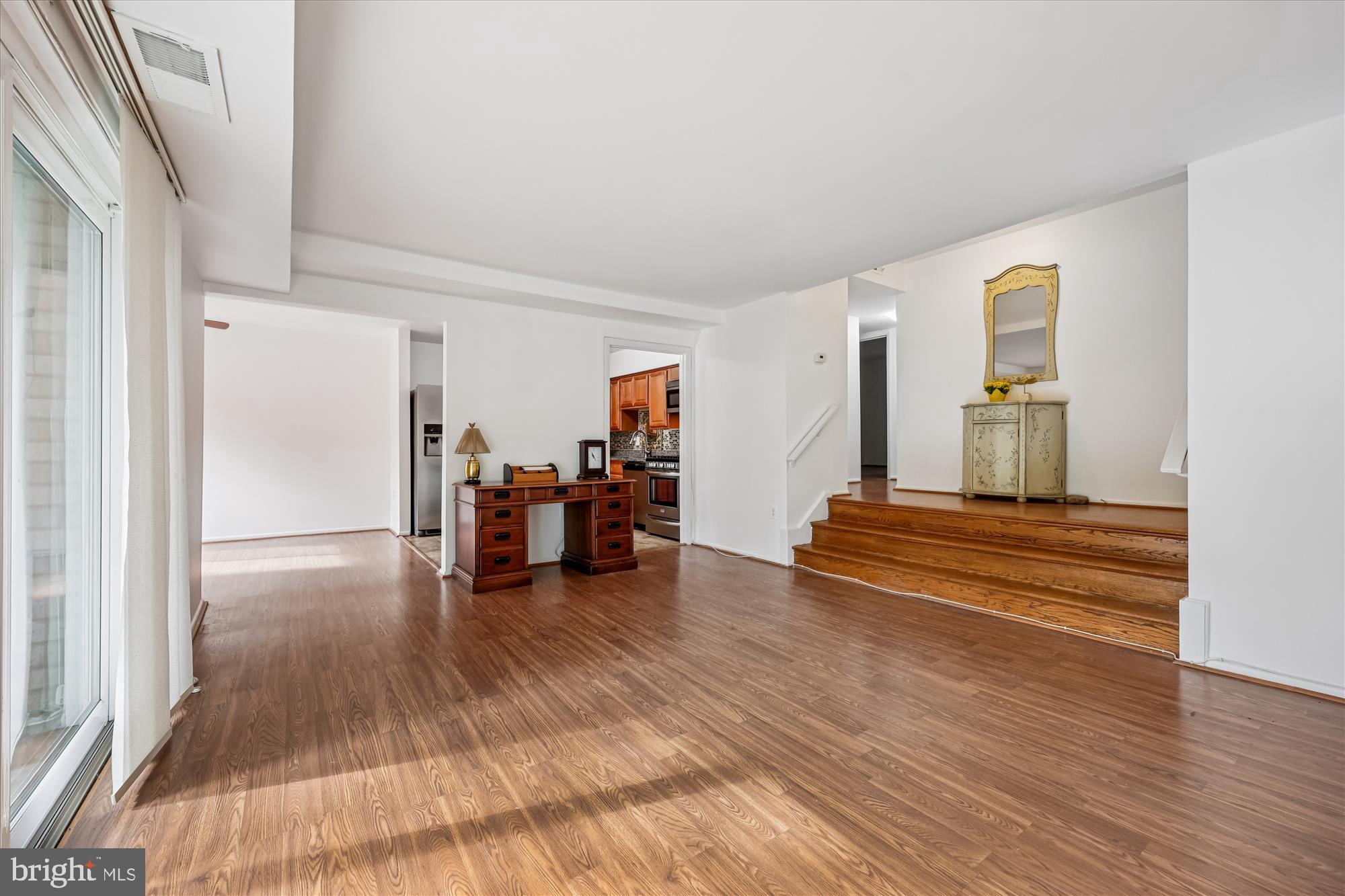 14428 Parkvale Road, Unit 3 Rockville, MD 20853 - Photo 6 of 37 a living room with furniture and a wooden floor