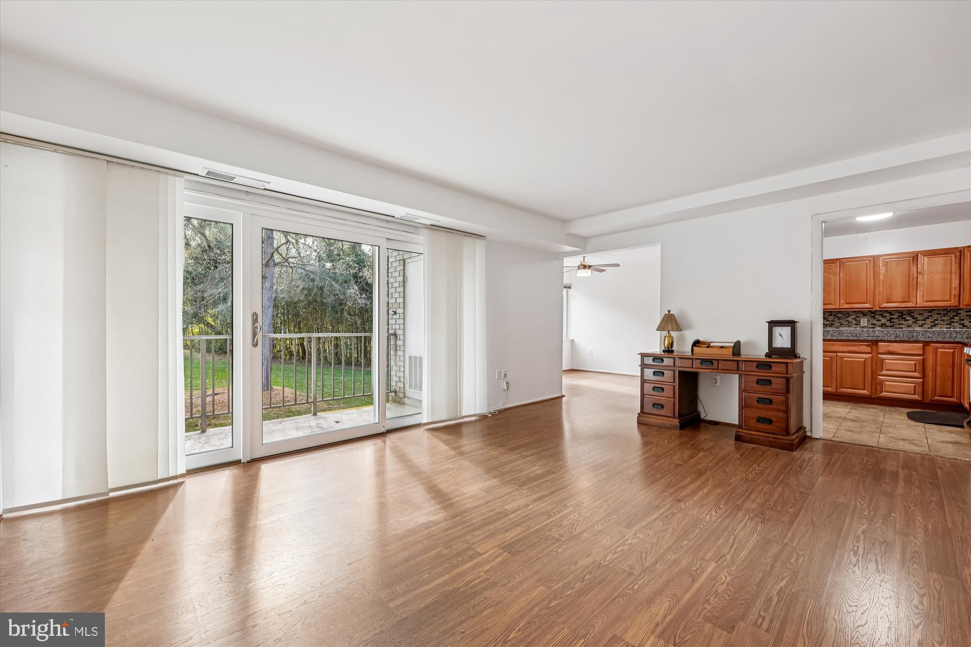 14428 Parkvale Road, Unit 3 Rockville, MD 20853 - Photo 10 of 37 a living room with furniture and a wooden floor