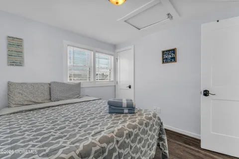 a bedroom with a large bed and a window