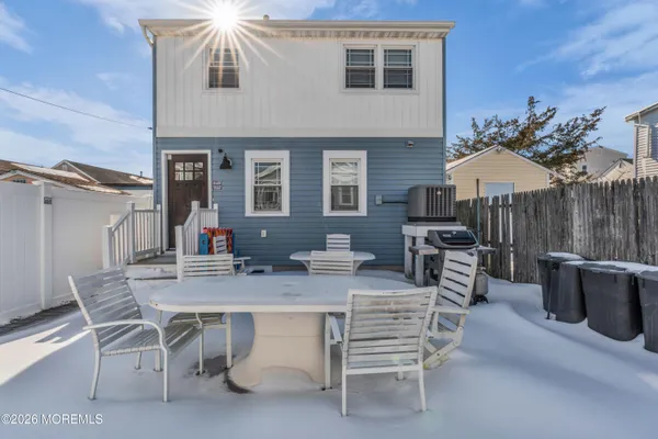 a view of a dinning table and chairs in the patio