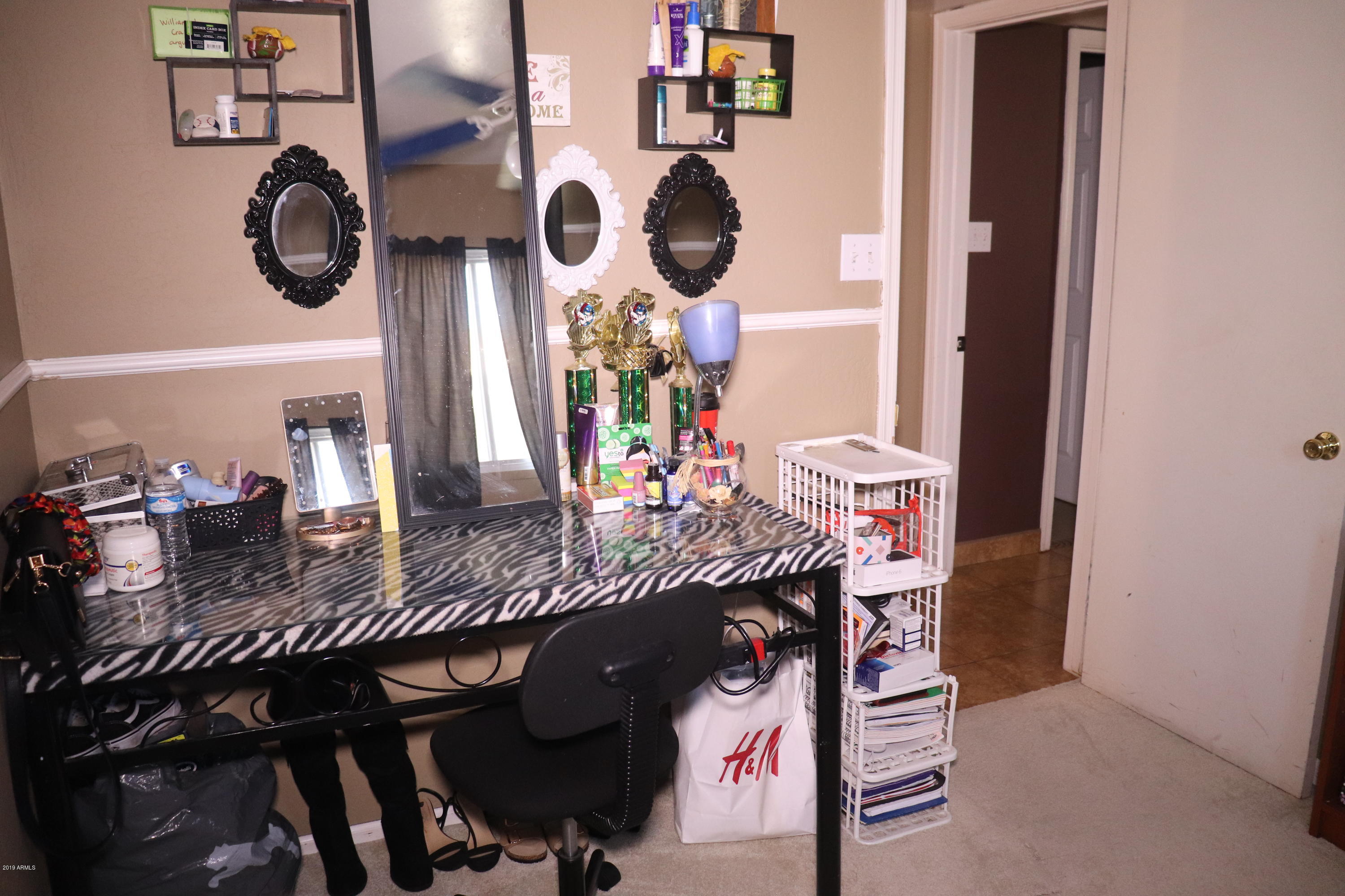 8233 West Osborn Road Phoenix, AZ 85033 - Photo 17 of 28 a view of dining room and kitchen island with furniture