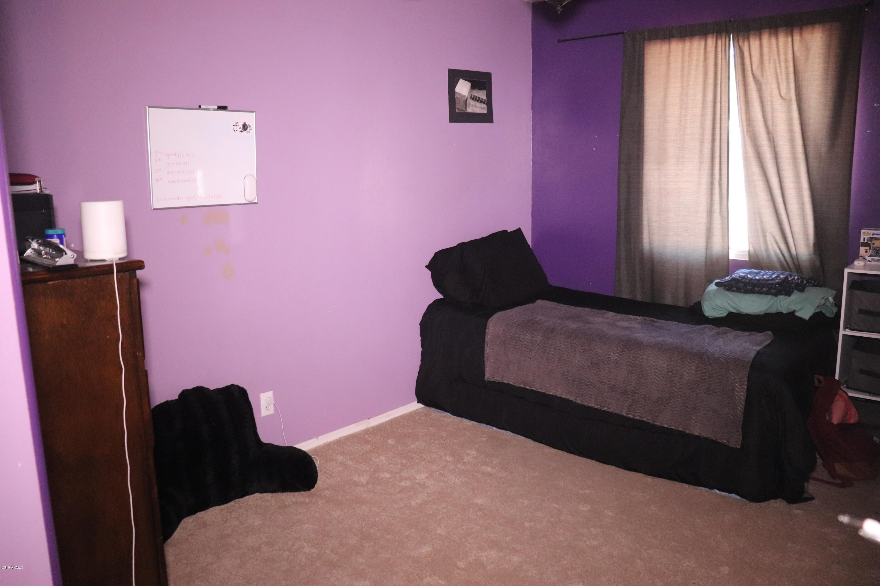 8233 West Osborn Road Phoenix, AZ 85033 - Photo 18 of 28 a bedroom with a bed and a window