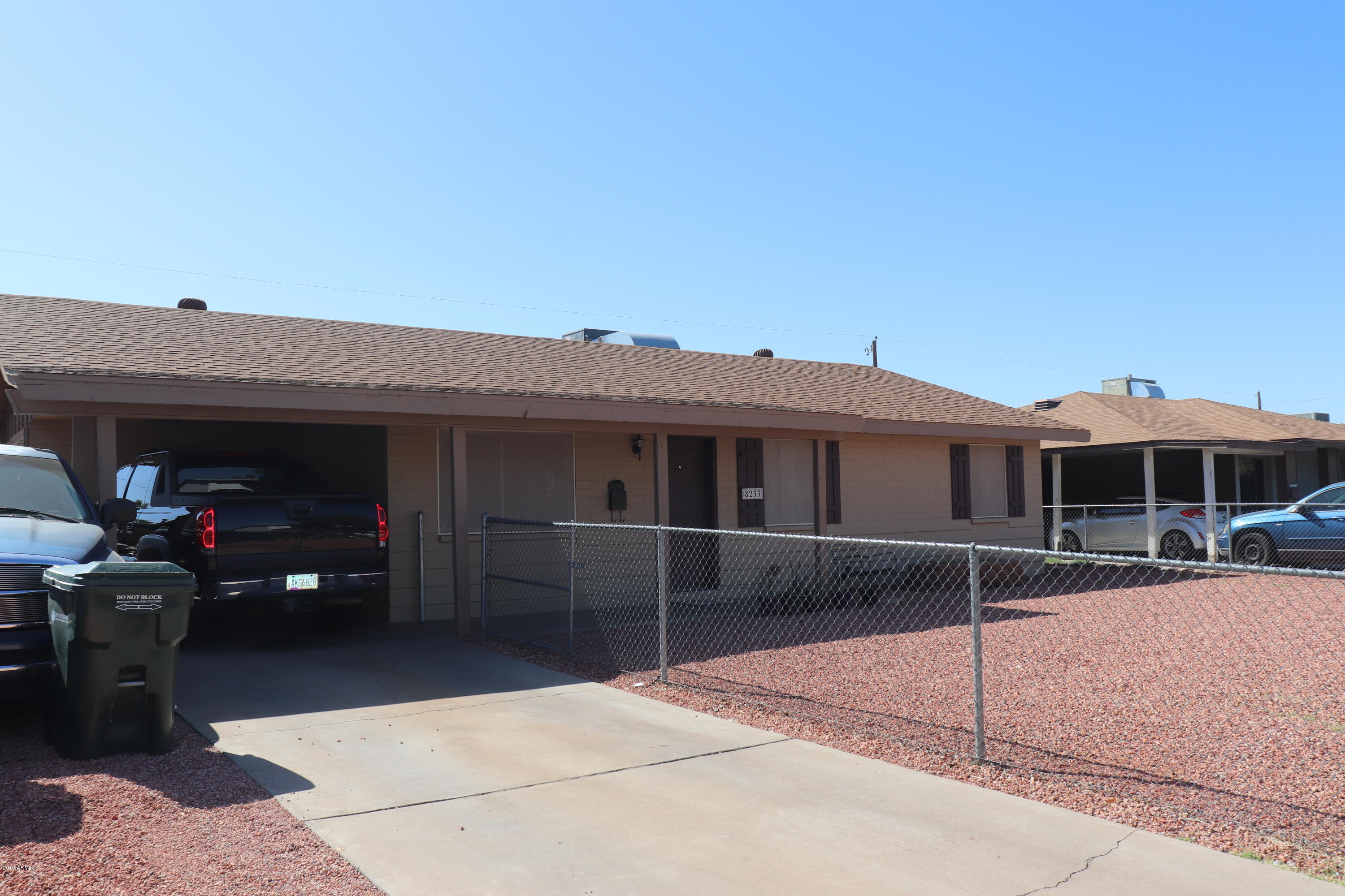 8233 West Osborn Road Phoenix, AZ 85033 - Photo 2 of 28 a front view of a house with a porch