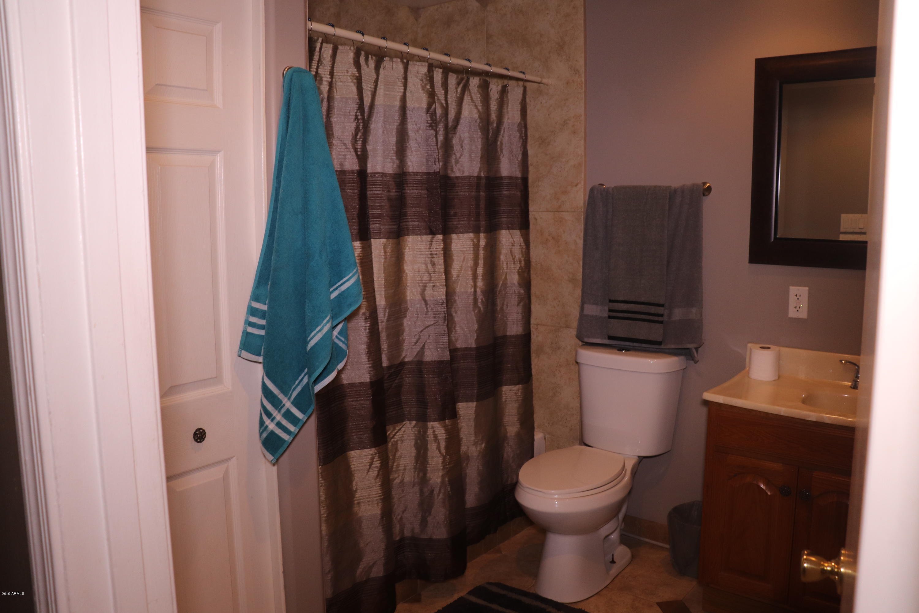 8233 West Osborn Road Phoenix, AZ 85033 - Photo 21 of 28 a bathroom with a toilet and a shower