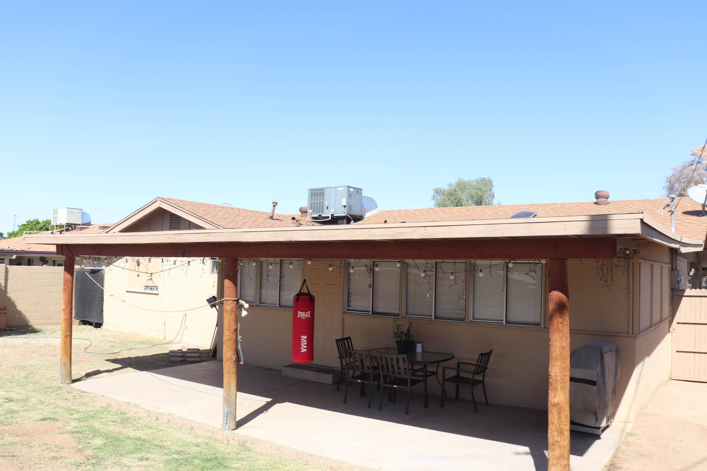 8233 West Osborn Road Phoenix, AZ 85033 - Photo 26 of 28 a front view of a house with a porch