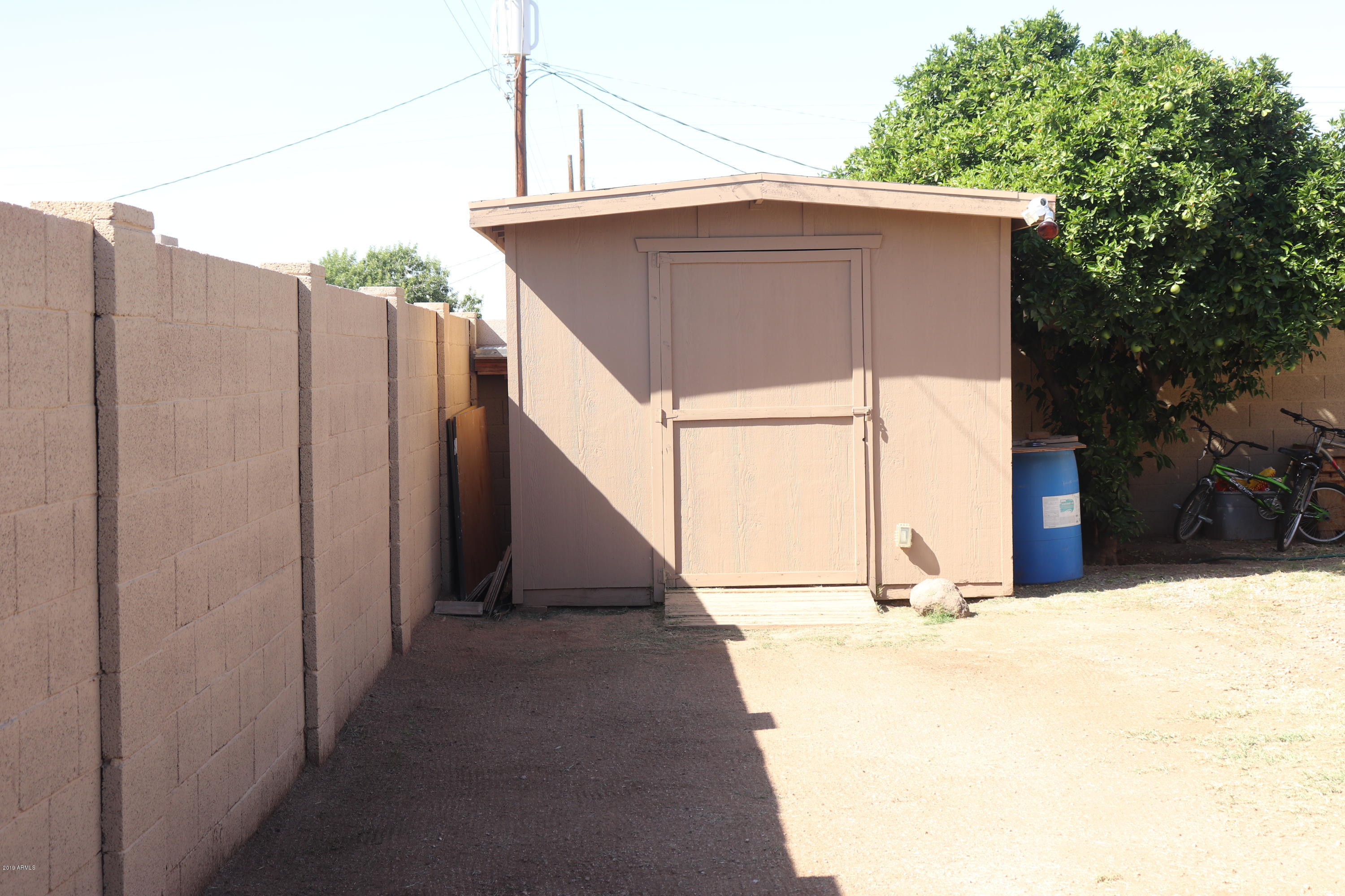 8233 West Osborn Road Phoenix, AZ 85033 - Photo 28 of 28 a view of a house with a fence