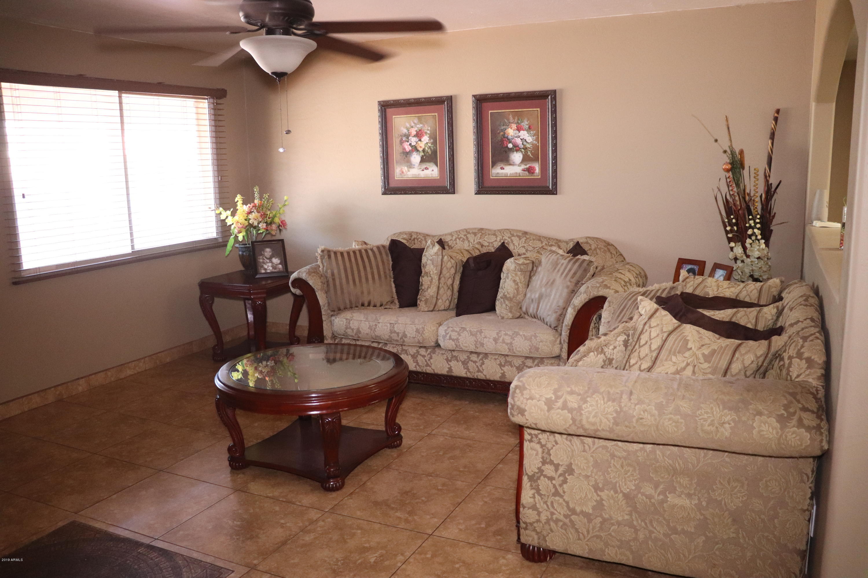 8233 West Osborn Road Phoenix, AZ 85033 - Photo 3 of 28 a living room with furniture and a window