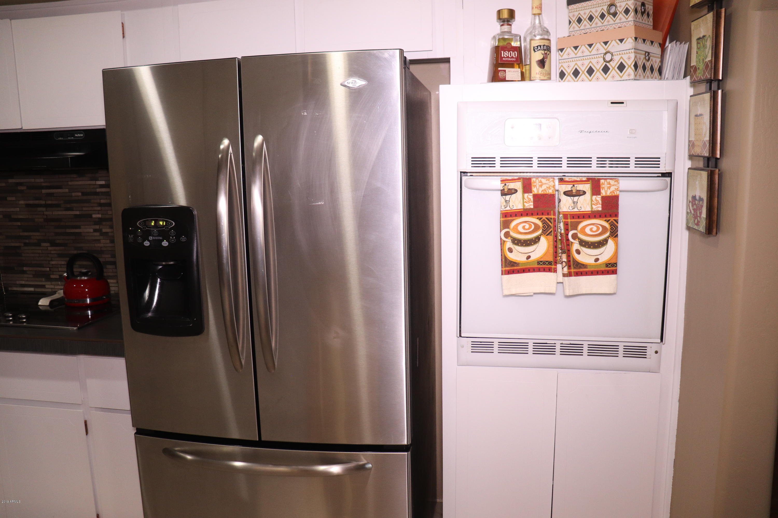8233 West Osborn Road Phoenix, AZ 85033 - Photo 8 of 28 a close view of a refrigerator in kitchen