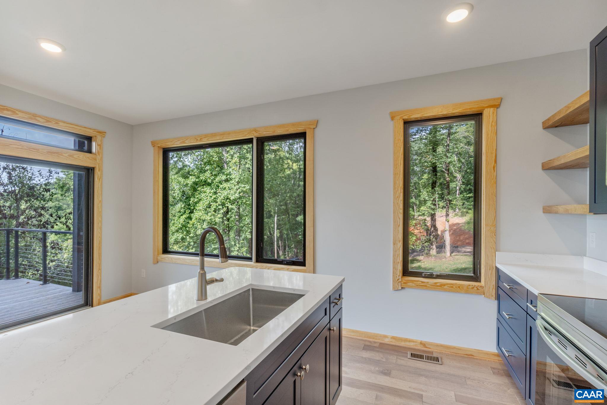 181 Turkey Ridge Road Stanardsville, VA 22973 - Photo 20 of 38 a kitchen with a sink and large window