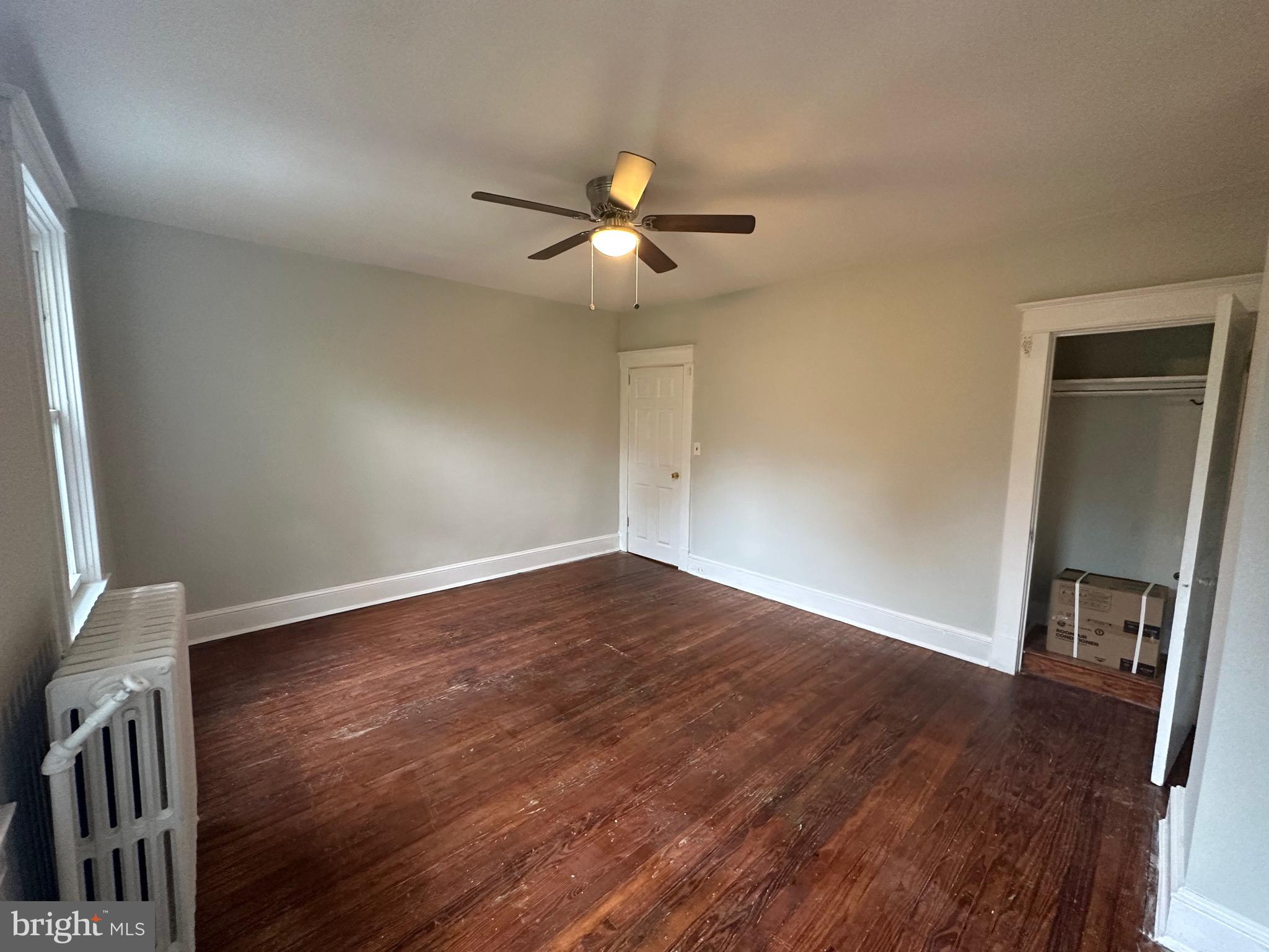 4227 Euclid Avenue, Unit B Baltimore, MD 21229 - Photo 19 of 87 a view of empty room with wooden floor