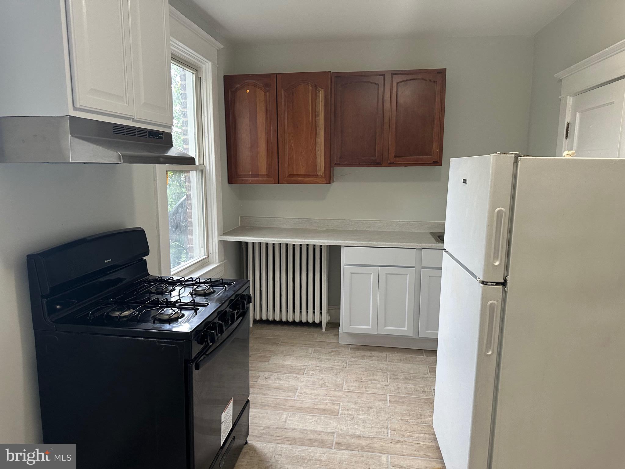 4227 Euclid Avenue, Unit B Baltimore, MD 21229 - Photo 28 of 87 a kitchen with a refrigerator and a stove
