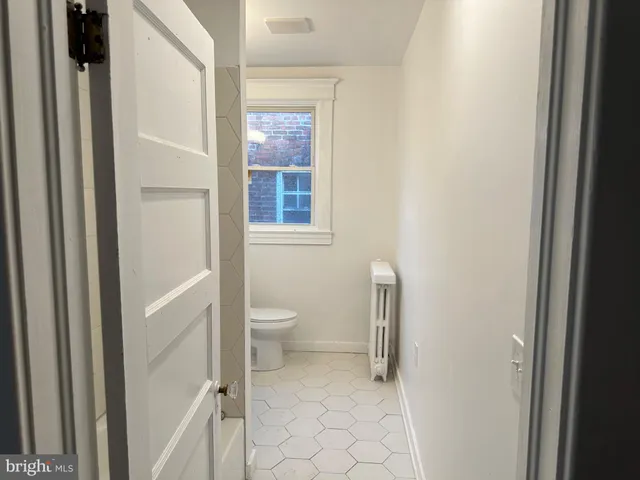 a white refrigerator freezer sitting in a kitchen