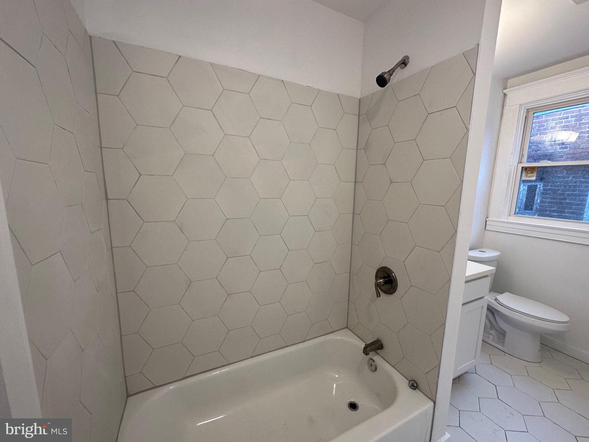 4227 Euclid Avenue, Unit B Baltimore, MD 21229 - Photo 4 of 87 a bathroom with a bathtub and a toilet