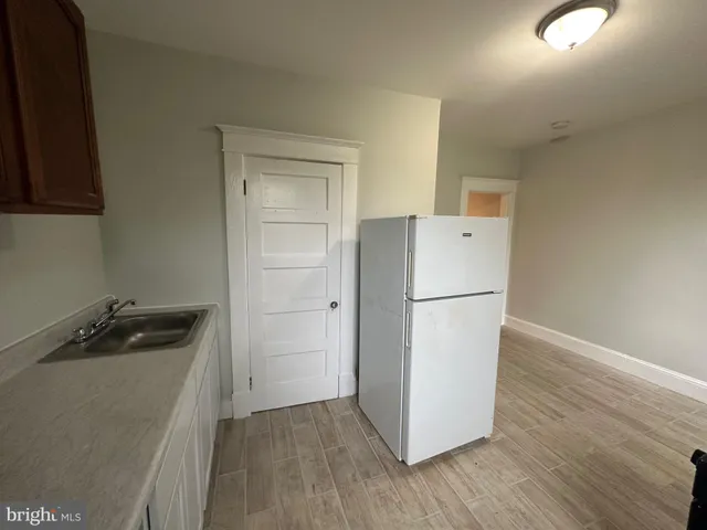 a view of a hallway with a wooden floor