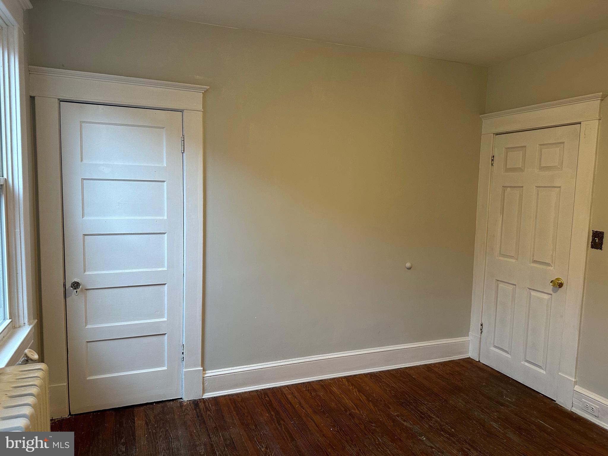 4227 Euclid Avenue, Unit B Baltimore, MD 21229 - Photo 45 of 87 a view of an empty room with wooden floor