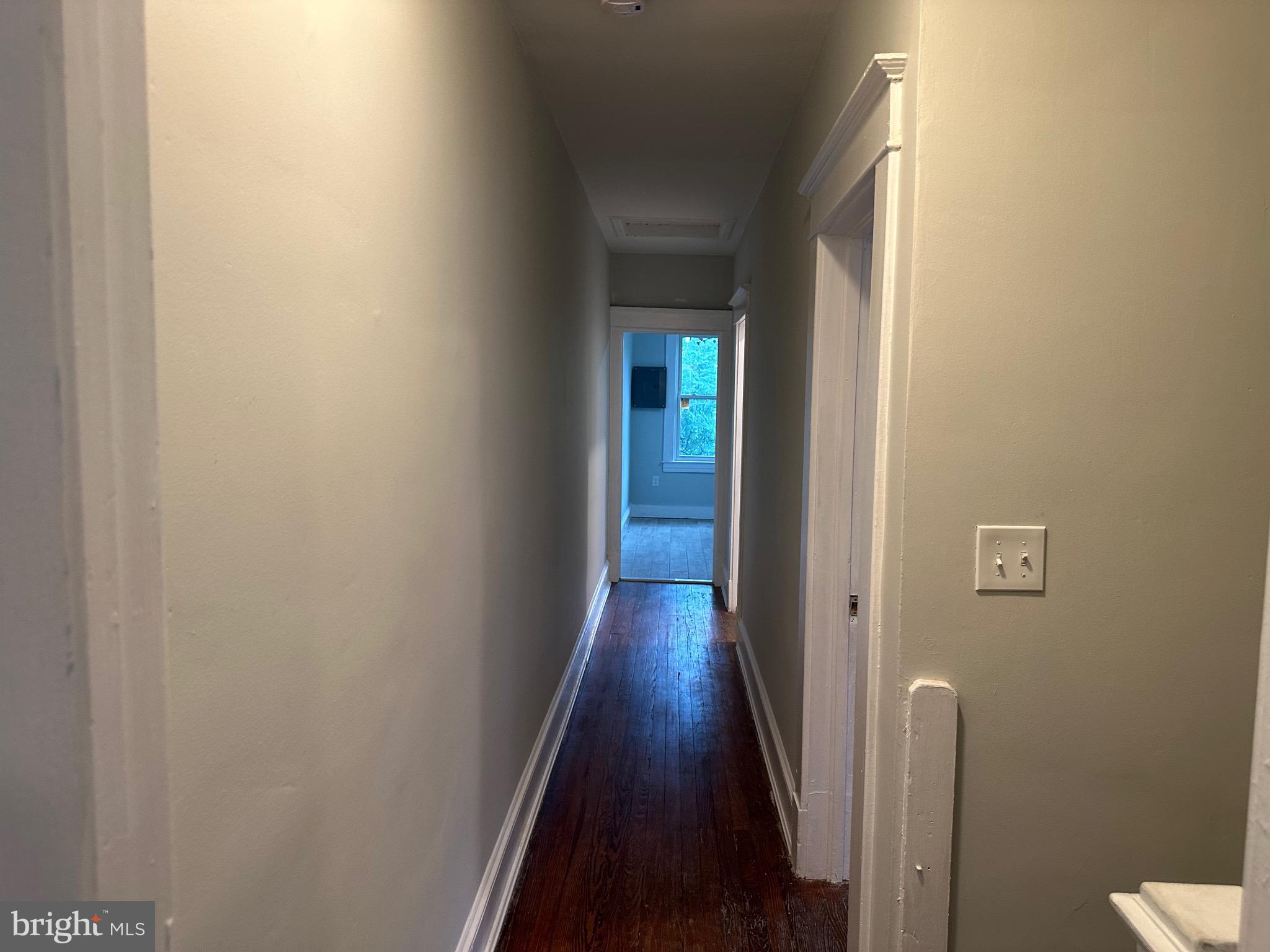 4227 Euclid Avenue, Unit B Baltimore, MD 21229 - Photo 61 of 87 a view of a hallway with wooden floor