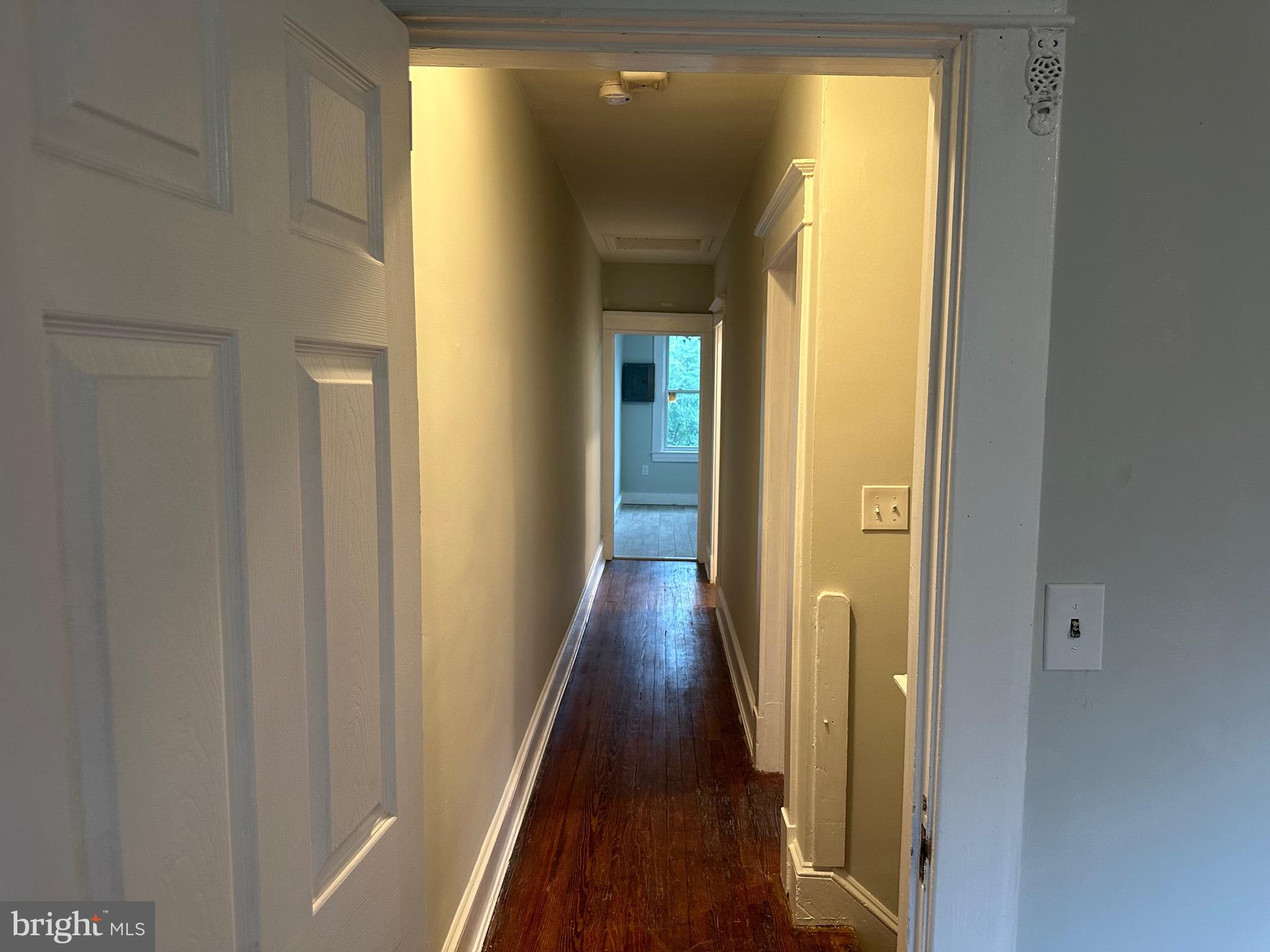 4227 Euclid Avenue, Unit B Baltimore, MD 21229 - Photo 63 of 87 a view of a hallway with wooden floor