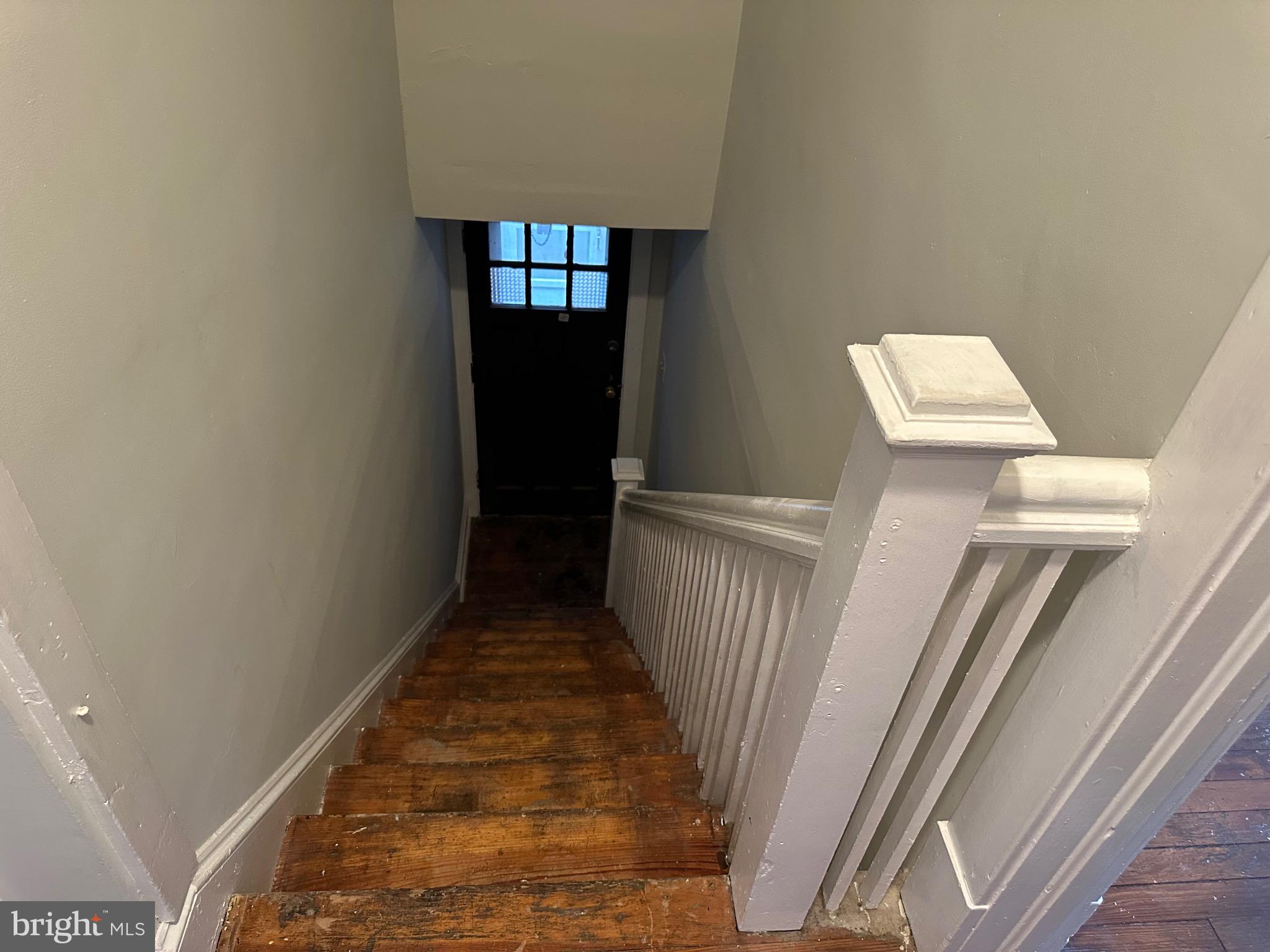 4227 Euclid Avenue, Unit B Baltimore, MD 21229 - Photo 72 of 87 a view of a hallway with wooden floor and staircase