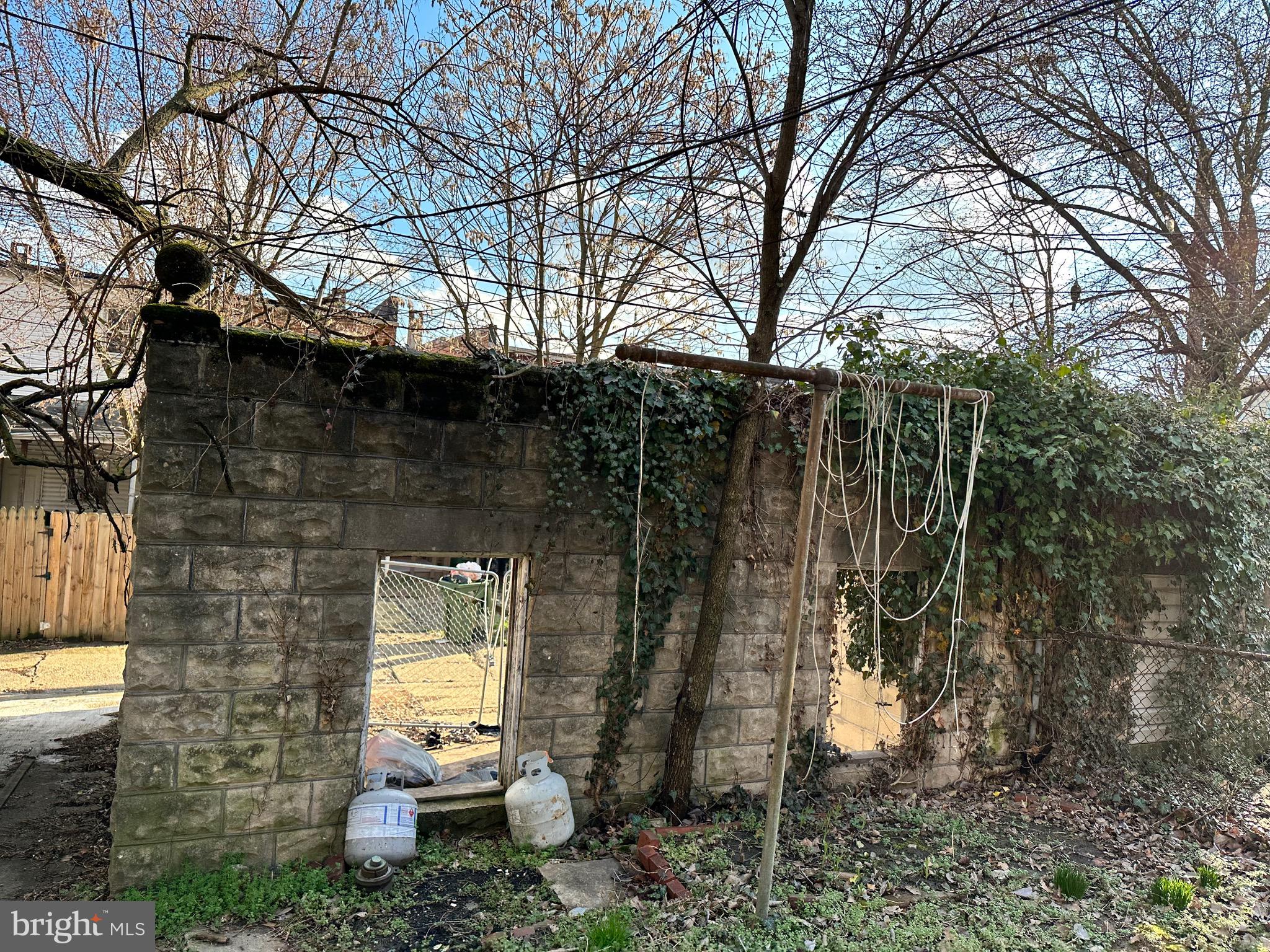 4227 Euclid Avenue, Unit B Baltimore, MD 21229 - Photo 85 of 87 a backyard of a house with lots of green space and glass windows