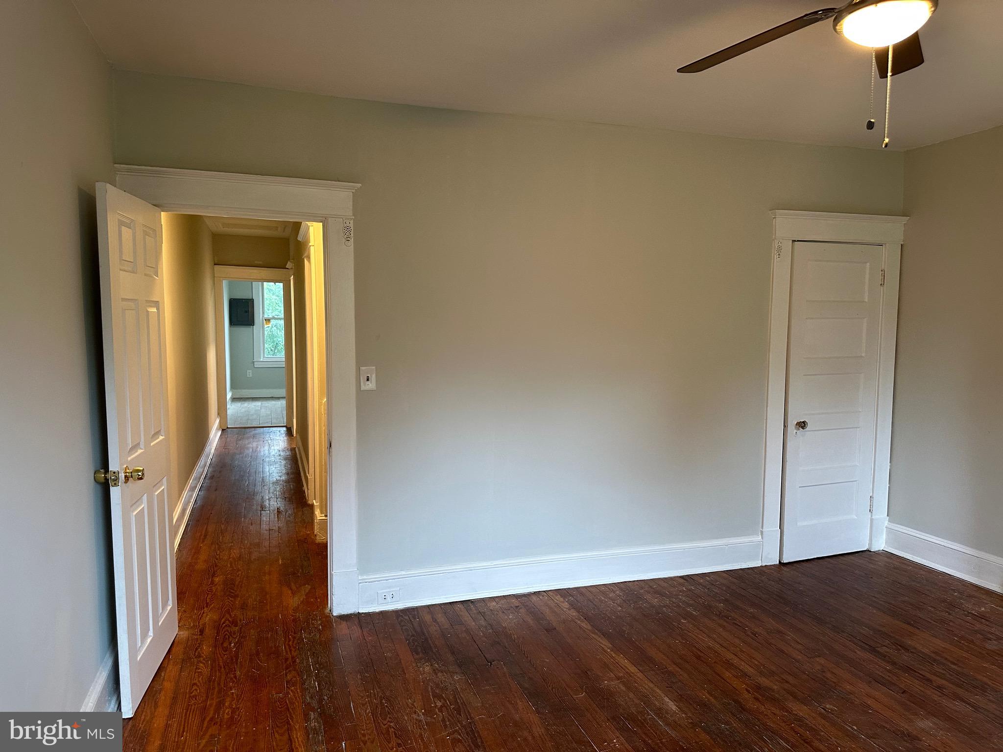 4227 Euclid Avenue, Unit B Baltimore, MD 21229 - Photo 10 of 87 a view of a hallway with wooden floor and chandelier