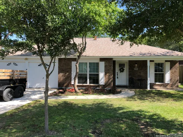 a view of a house with backyard sitting area and porch