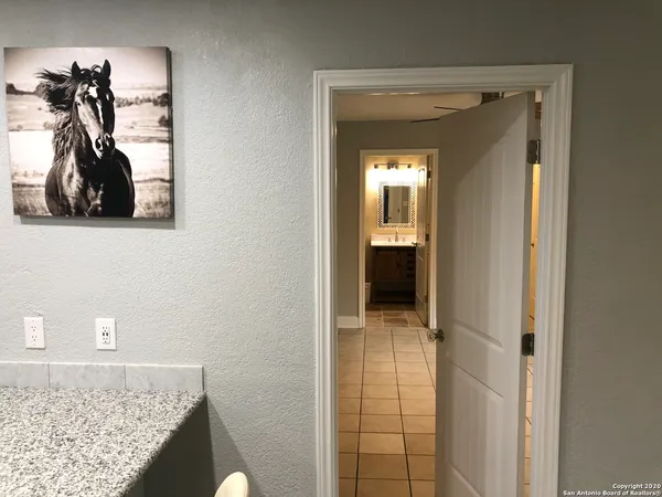 a view of an empty room and closet area