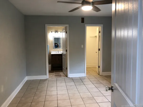 a bathroom with a toilet sink and shower