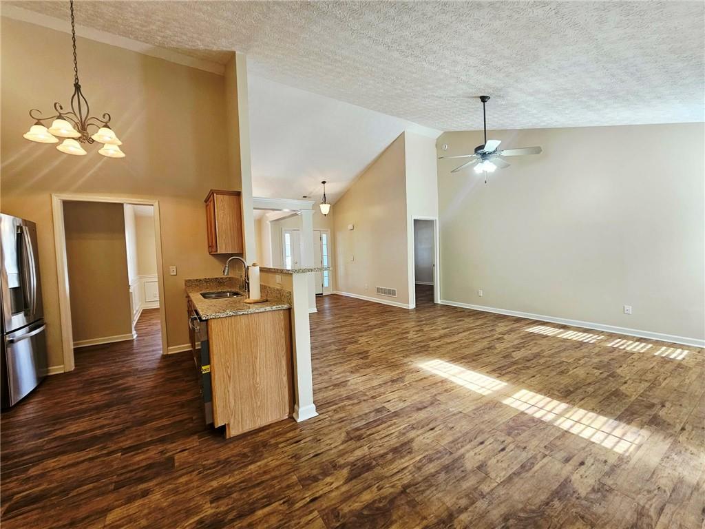 190 Berkley Drive Villa Rica, GA 30180 - Photo 14 of 38 a view of kitchen and hall with wooden floor
