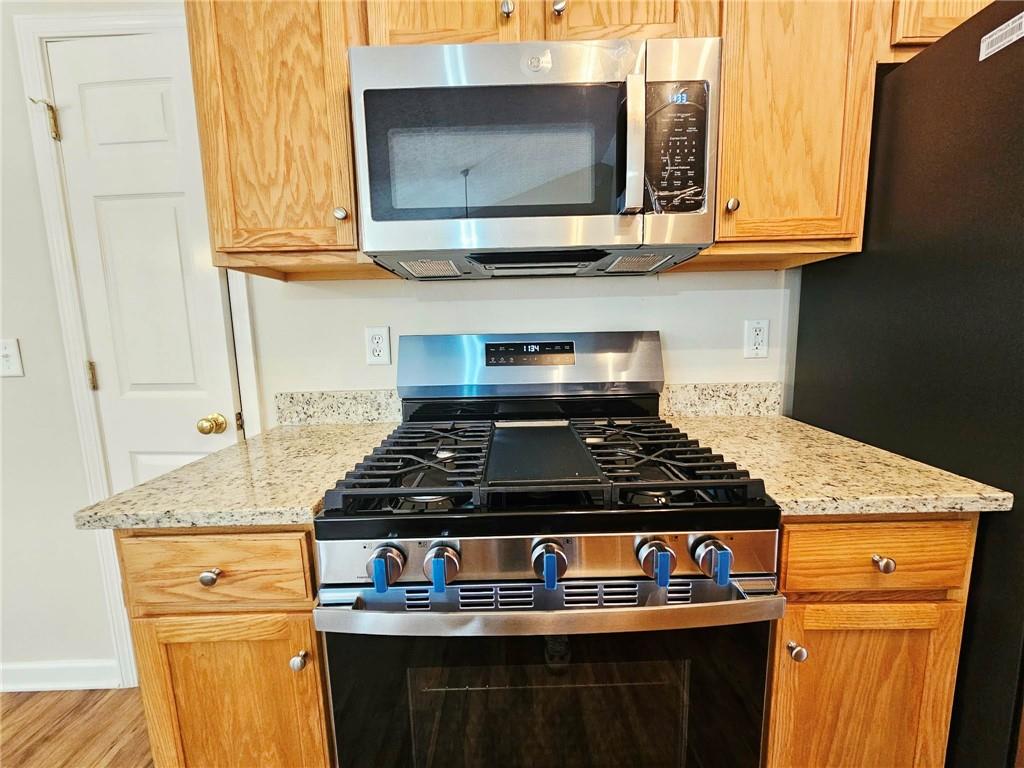 190 Berkley Drive Villa Rica, GA 30180 - Photo 18 of 38 a stove top oven sitting inside of a kitchen