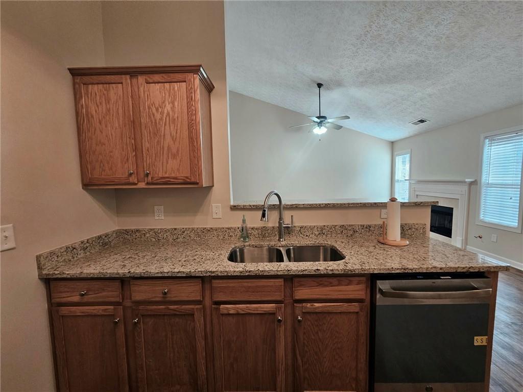 190 Berkley Drive Villa Rica, GA 30180 - Photo 20 of 38 a view of a granite counter top a sink a cabinets and window in a room