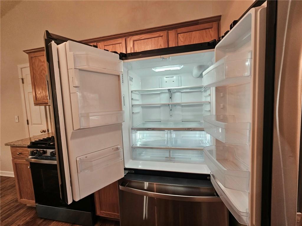 190 Berkley Drive Villa Rica, GA 30180 - Photo 22 of 38 a view of walk in closet with empty racks