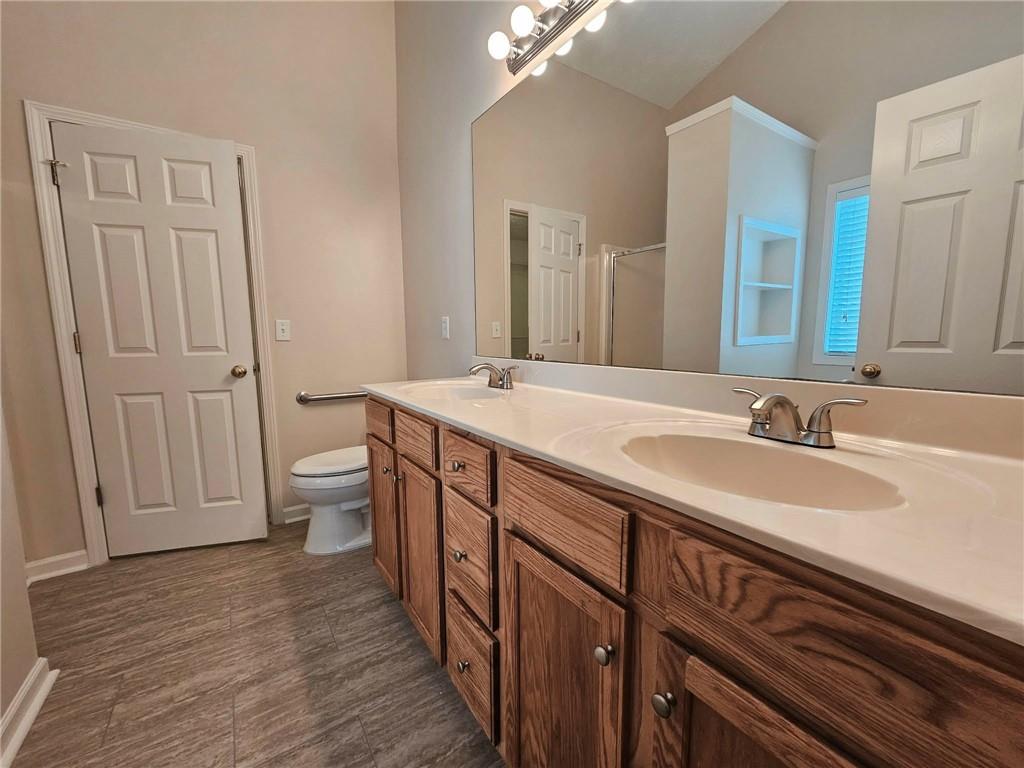 190 Berkley Drive Villa Rica, GA 30180 - Photo 24 of 38 a bathroom with a double vanity sink and a mirror
