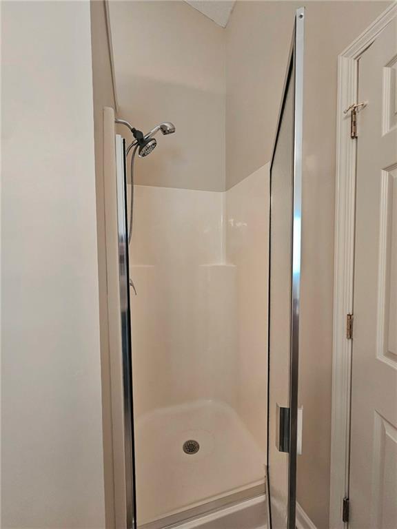 190 Berkley Drive Villa Rica, GA 30180 - Photo 26 of 38 a bathroom with a glass shower door