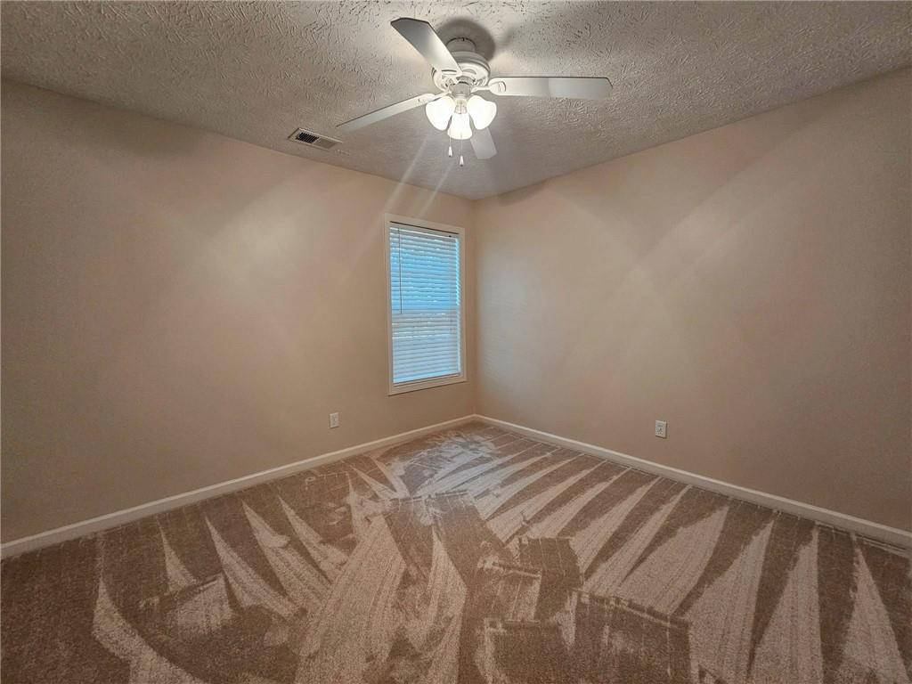 190 Berkley Drive Villa Rica, GA 30180 - Photo 28 of 38 a view of room with window and ceiling fan