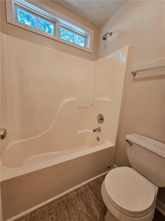 190 Berkley Drive Villa Rica, GA 30180 - Photo 31 of 38 a white toilet and tub sitting next to a bathroom sink