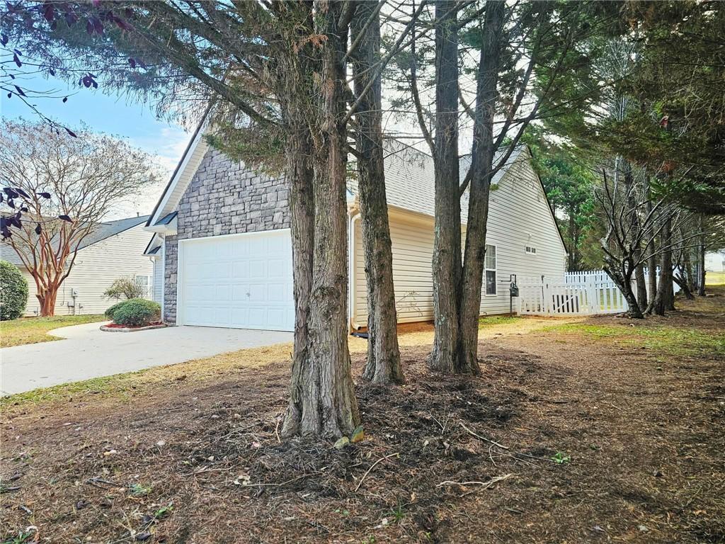 190 Berkley Drive Villa Rica, GA 30180 - Photo 6 of 38 a tree in the middle of a yard