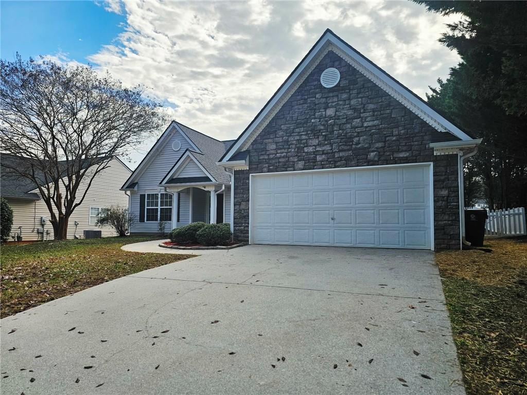 190 Berkley Drive Villa Rica, GA 30180 - Photo 7 of 38 a front view of a house with a yard and garage
