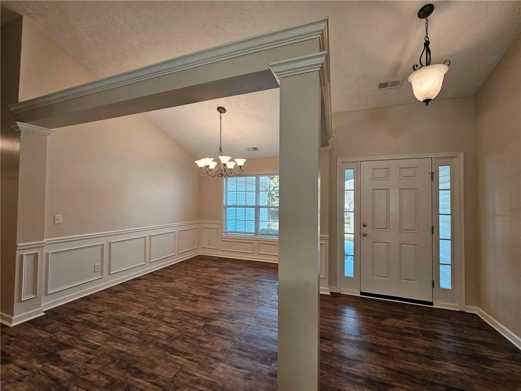190 Berkley Drive Villa Rica, GA 30180 - Photo 8 of 38 a view of an empty room with wooden floor and a window
